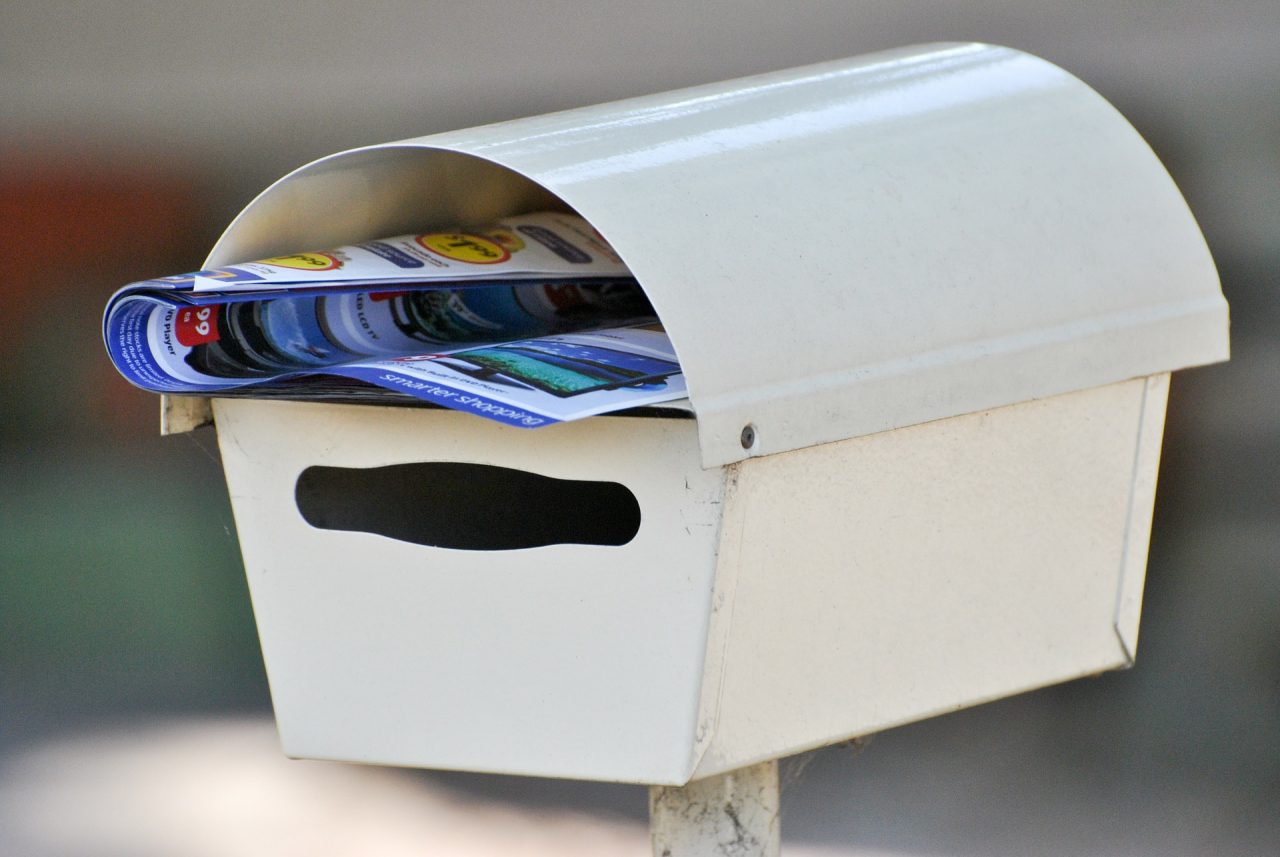 is putting business cards in mailboxes illegal 2